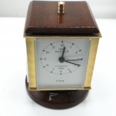 A Sewills four dial clock. Seen running. Postage D