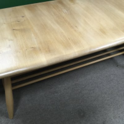 A Ercol occasional table United by under tier .