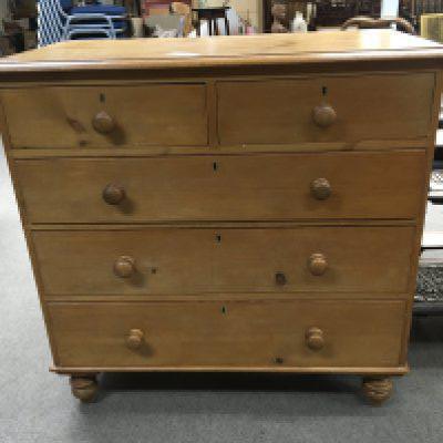 A late Victorian pine chest of drawers fitted with two short and three long drawers with bun handles and turned legs good condition. Height 104cm length 107cm