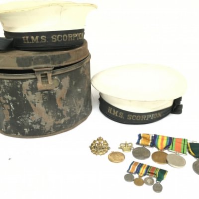 A collection of war items including WW1 & WW2 medal group awarded to Capt. W. Lefeaux consisting of The Territorial Force Efficiency medal, The defence medal, Victory medal, War medal. Including miniature medals. Two H.M.S scorpion hats with tin case belonging to a R. Keene. Postage category C
