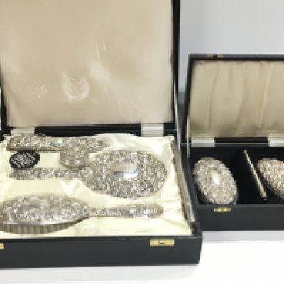 Two cased silver hallmarked brush sets. Postage category C