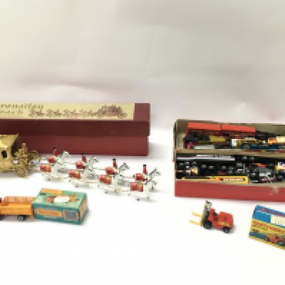 A collection of toy vehicles including Lesney Coronation coach and two boxed matchbox vehicles. Postage B