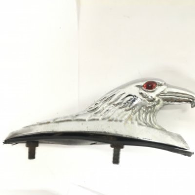 A chrome eagles head ornament for the rear mudguard of a motorbike to wire up to stop lights. 15cm long. Postage category B