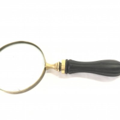 A heavy brass magnifying glass, this lot cannot be posted