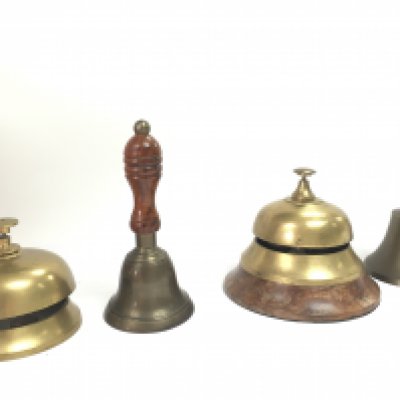 Two brass counter bells and two small hand bells, postage category B