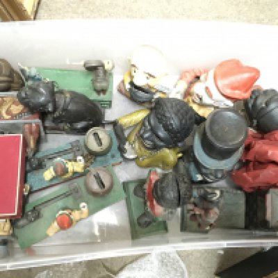 A Collection of vintage and modern money boxes including cast iron Uncle Sam, Bull dog bank, Trick dogs, Artillery bank etc. this lot cannot be posted Notice from the&#2013266080the-saleroom.com:&#2013266080These items are listed on the basis they are illustrative of a bygone culture in which there were different social norms. We understand the potential controversy surrounding this type of item but believe that providing transparent information about historical context fosters greater understanding of our complex cultural history.