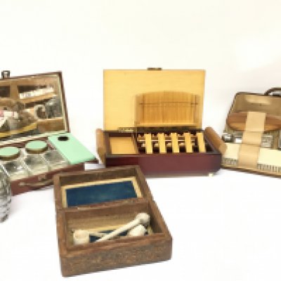 A a cigarette/cigar box, novelty grenade table lighter, carved wooden trinket box with clay pipes and dressing kits. Postage category B