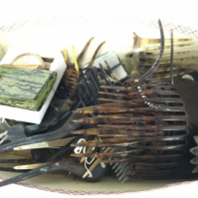 A Collection of vintage tortoiseshell combs and other items. Postage cat B