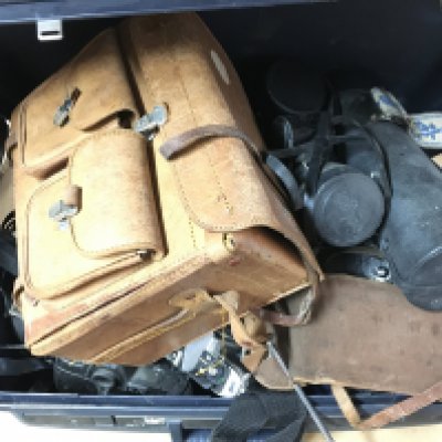 A large collection of vintage cameras and equipment including a Nikon F-801 with a Nikon 300mm lens, Nikon FG-20 with a Sigma 200m lens, Photax 400mm lens, Corfield Periflex, Zenit-E etc