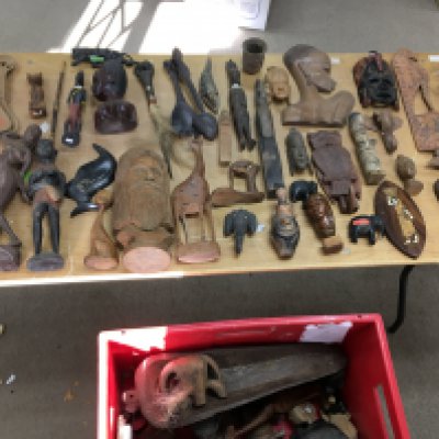 A large collection of carved wood art much African in origin. Postage C