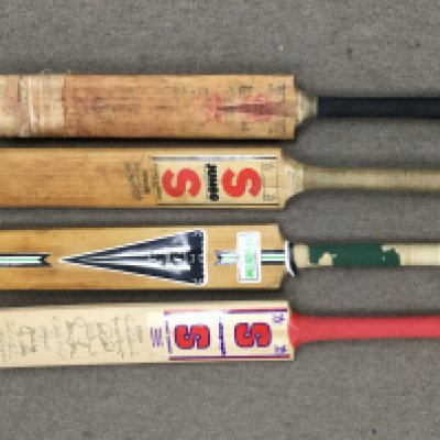 Four cricket bats signed by Essex and other county teams