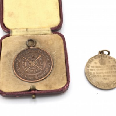 A cased Royal life saving society medal and a 1911 coronation medal.Postage B