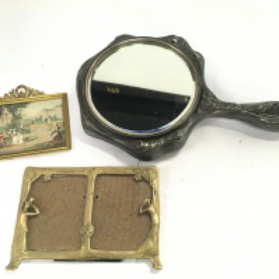 An art nouveau embossed pewter hand mirror, art nouveau small gilt framed double picture frame and a small gilt framed picture. This lot cannot be posted