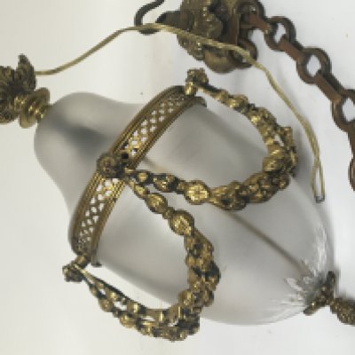 A brass and glass hall lantern with raised brass garlands.no obvious damage with chain and ceiling rose and a pair of unusual Victorian nut crackers in a fitted box (2)