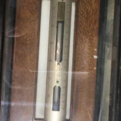 A cased ships stick barometer.