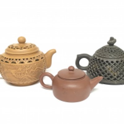 Three Chinese Yixing teapots. 5 to 9cm tall approximately. Restoration seen on smallest teapot This lot cannot be posted