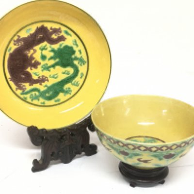 Late 19th century Chinese yellow ground bowl and plate incised with green dragons and other decoration, both with six character marks to the base. 14 and 11.5cm wide. Restoration seen on the bowl. This lot cannot be posted