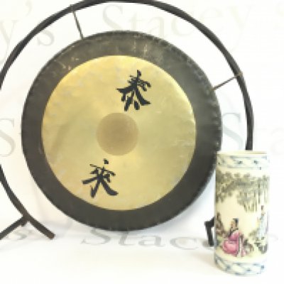 A Chinese bronze gong with an iron frame (30cm tall) and a small Chinese porcelain brush pot 12cm tall. This lot cannot be posted