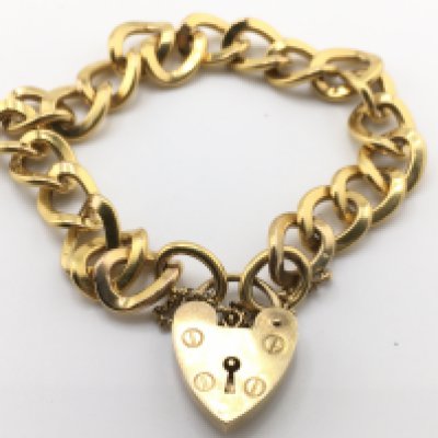 A 9 carat gold curb bracelet, 40g. Postage category a