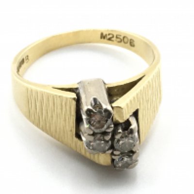 An 18 carat 4 diamond set ring, size O, 8.9g. Postage category a