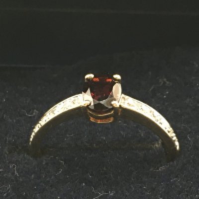 A 9 carat ruby and diamond shard set ring, size P. 2.1g Postage category A