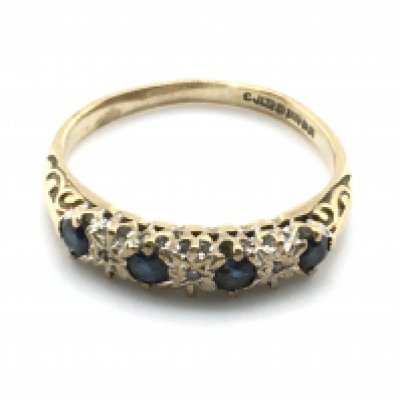 A 9 carat gold blue sapphire and diamond ring