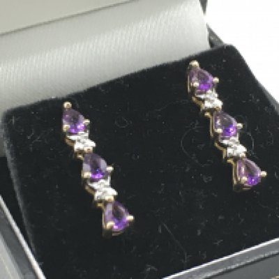 A pair of 9 carat amethyst and diamond drop earrings , 1.9g total weight. Postage category a