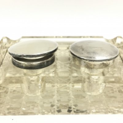 A silver hallmarked cut glass inkwell. This lot cannot be posted