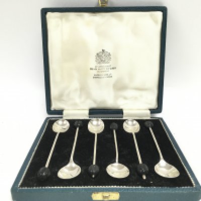 A cased set of silver hallmarked Mappin and Webb coffee spoons. Postage category B