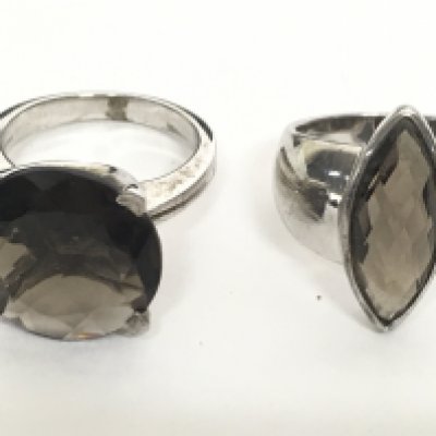 Two silver smokey quartz rings, sizes S & N. postage category A