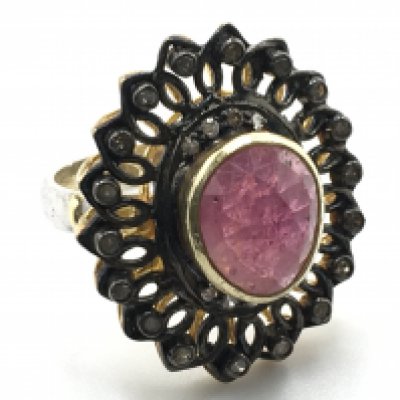 A silver gilt ruby and diamond vintage style dress ring, mixed oval cut ruby 3.30ct, diamonds 0.25ct. Size L. Postage category A
