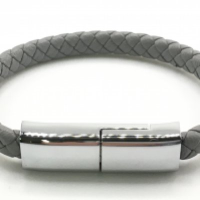 A grey leather effect rose-style bracelet with stainless steel centre opening USB style clasp. Postage category a