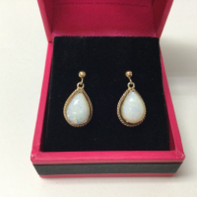 A pair of 9ct opal drop earrings.