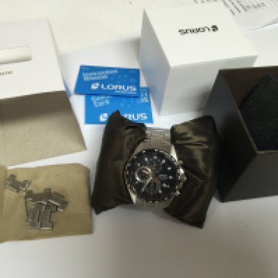 A Lorus 10 Bar Chronograph watch as new seen working with box paperwork and extra links.
