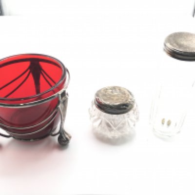 Small silver topped jars and a cranberry glass sugar bowl. Postage D