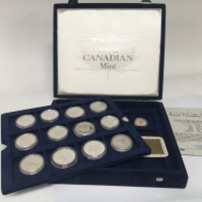 A Royal Canadian Mint silver dollar collection of coins (500) silver sixteen coins total with certificates in a fitted box.