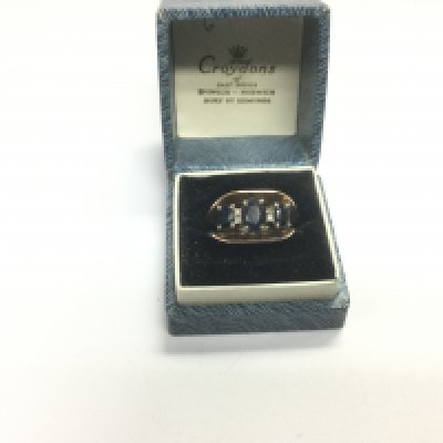A 9ct gold ring set with sapphires and diamonds, approx 4.1g and approx size M-N. Shipping category A.