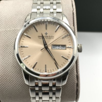 A Dreyfuss and co day date watch with box and papers. Seen running. Excellent condition. 40mm case including crown.