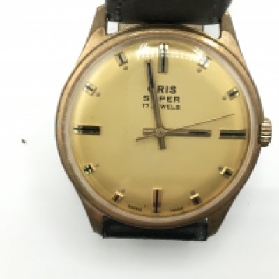 A vintage Oris super 17 jewel manual wind watch. Gold coloured dial. Winds and runs. Approximately 35mm case.