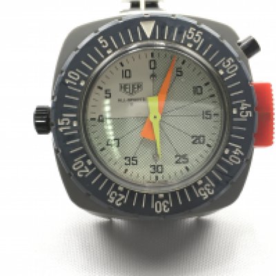 Heuer wrist timer all sports II model. 48mm case. In good condition with original Tropic strap. Seen running. Postage B