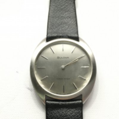 As new Bulova Longchamp gents wrist watch with silver coloured dial and black leather strap. Comes with box. Seen running.