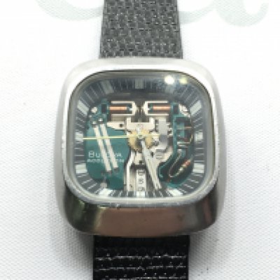A gents Bulova Accutron with visible movement set in square case. Not seen working.