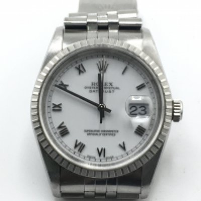 A rolex oyster perpetual date just ref 16200. 36mm steel case with white dial. Paperwork no box. Seen running.