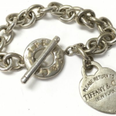 A silver bracelet marked Tiffany , postage category A