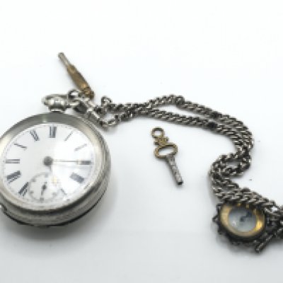 A silver key wind pocket watch with chain. Winds and runs. Postage B