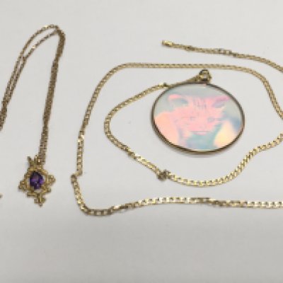 Two 9ct gold chains, one with a pendant set with amethystA, approx 6.5g. Shipping category A.