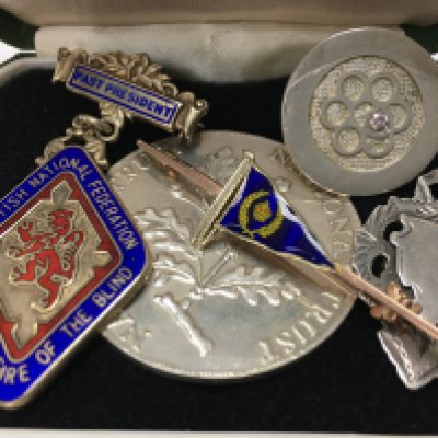A 9ct gold and enamel flag brooch 3.3g in total, an enamelled Scottish National Federation for the blind brooch and some silver items. Postage category a