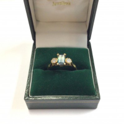 An 18ct gold unusual tourmaline ring with flanking diamonds. Approx size R, approx weight 3.86 grams.