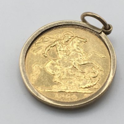 A 1964 full sovereign in a 9ct gold pendant mount. 9.10g Postage A