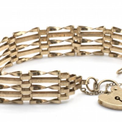 A 9ct gold gate bangle, total weight 11g. Postage category a